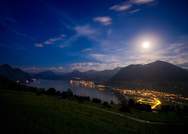 night landscape with lake and city lights