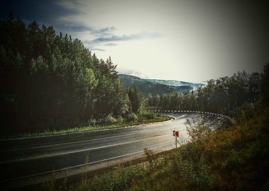 Winding Road Through Forest Landscape