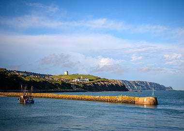 Coastal Scene with Boat and Breakwater