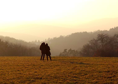 Couple in a field at sunset