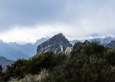 Mountain peak under cloudy sky