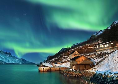 aurora borealis over coastal village