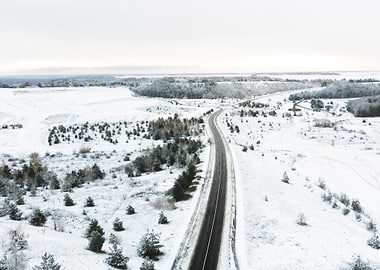 Winter Road Through Snowy Landscape
