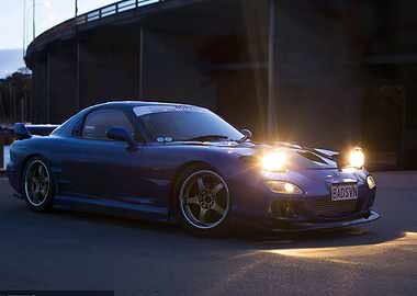 Blue Mazda RX-7 at Dusk