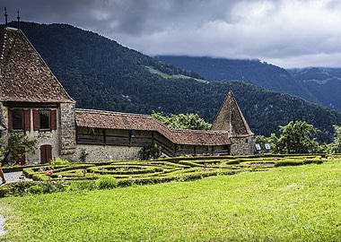 Gruyères Castle with Garden and Mountain Backdrop