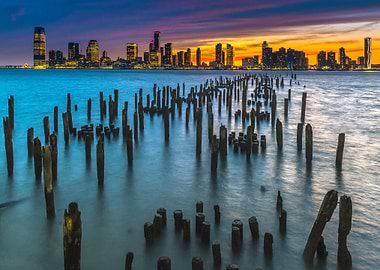 cityscape at sunset with wooden pilings