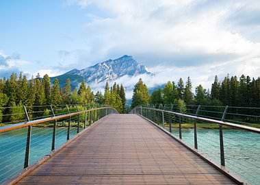 bridge over river with mountain view