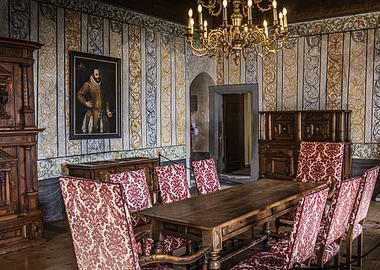 Ornate Dining Room with Portrait in Gruyères Castle