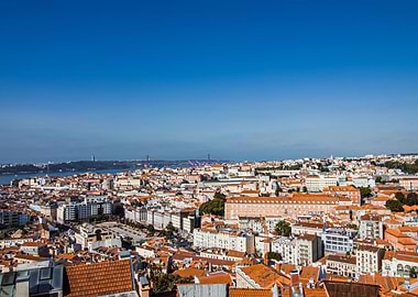 Lisbon cityscape under a clear blue sky