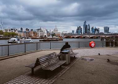 London cityscape with person on bench