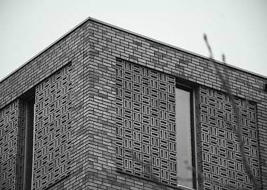 Monochrome Brick Building with Patterned Facade