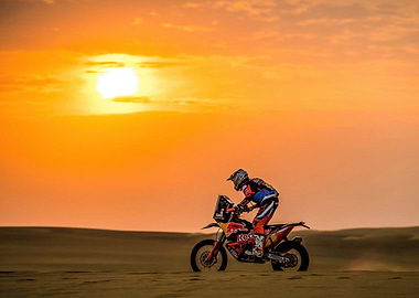 Motorcycle racing in the desert sunset