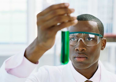 Scientist with Green Liquid in Test Tube