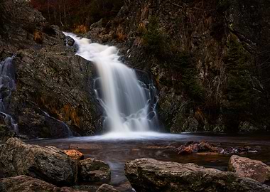 Waterfall cascading over rocks in nature