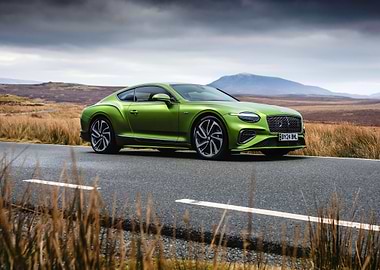 green bentley continental on open road