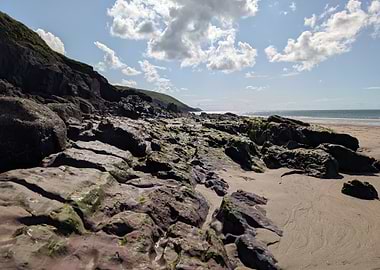 Rocky Beach Landscape with Cloudy Sky