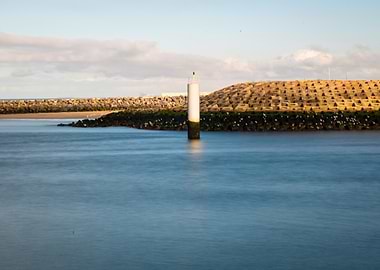 Coastal Beacon and Breakwater Landscape