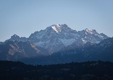 Snowy Mountain Peak Under Blue Sky