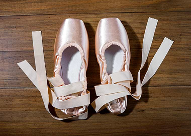 Ballet shoes on wooden floor