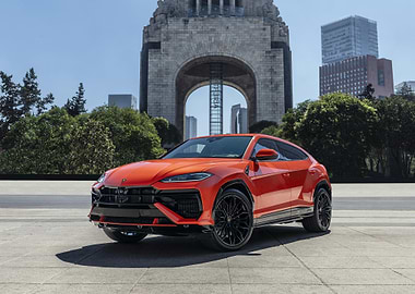 orange lamborghini urus in urban setting