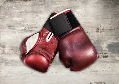 Red Boxing Gloves on Concrete Surface