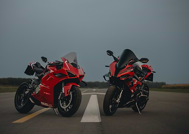 Two Red Motorcycles on Asphalt