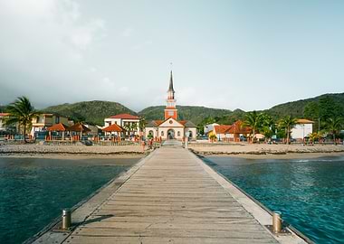 Tropical Pier Leading to Coastal Town