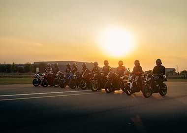 Motorcycle riders at sunset