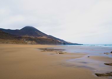 Beach landscape with mountain backdrop