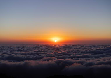 Sunrise Over The Clouds