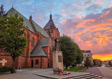 Gothic Cathedral in Koszalin and Statue of John Paul II at Sunset