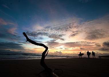Colorful Sunset Beach with Surfers Silhouette