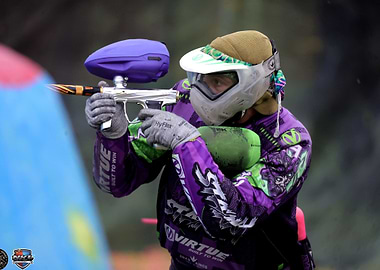Paintball Player Aiming with Gun