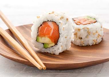 Sushi Rolls with Chopsticks on Plate