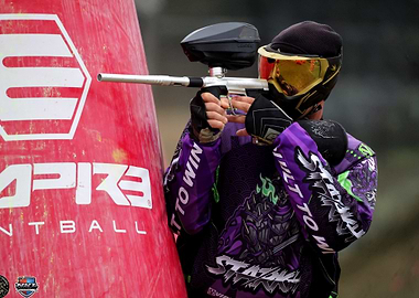 Paintball Player Aiming with Gun