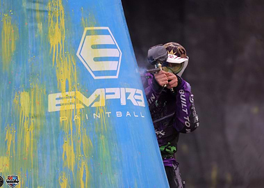 Paintball Player Aiming from Behind Cover