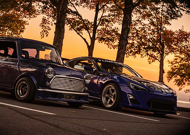 Two Blue Cars at Sunset