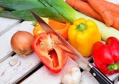 Fresh Vegetables and Knife on Wood