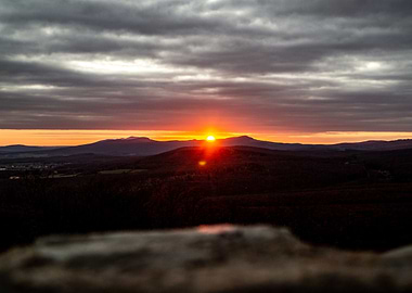 Dramatic Sunset Over Mountainous Landscape