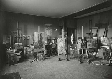 Artist in Studio with Paintings