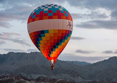 Colorful Hot Air Balloon Over Mountains