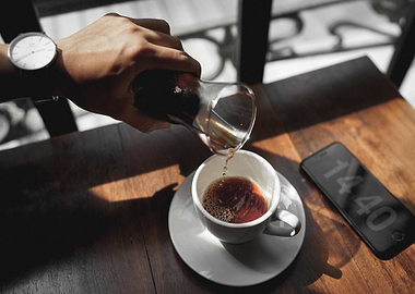 Pouring Coffee into a Cup
