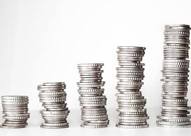 Stacks of Coins on White Background