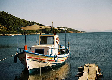 Fishing boat in calm blue water