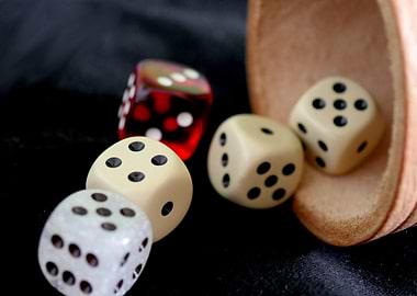 Dice and Cup on Black Background