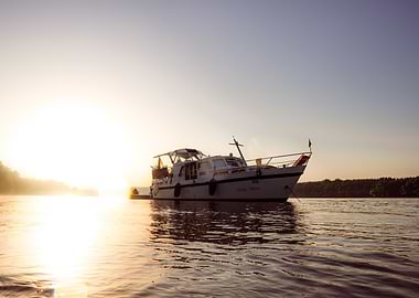 Boat on Water at Sunrise