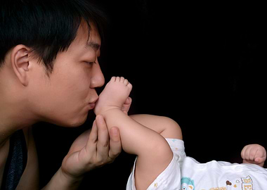 Father's Love: Kissing Baby's Foot