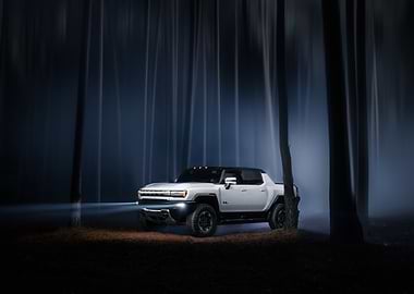 White Hummer EV in a Forest