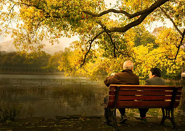 Autumn scene with people on bench