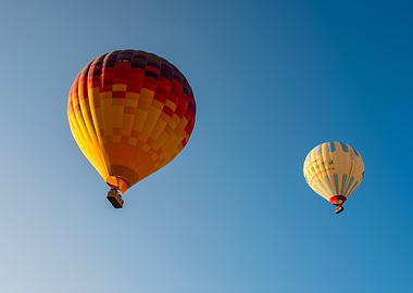 Two Hot Air Balloons in Blue Sky